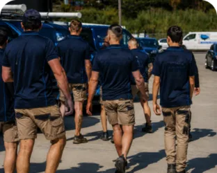 Plumbers walking to their service vans on a West Pennant Hills job